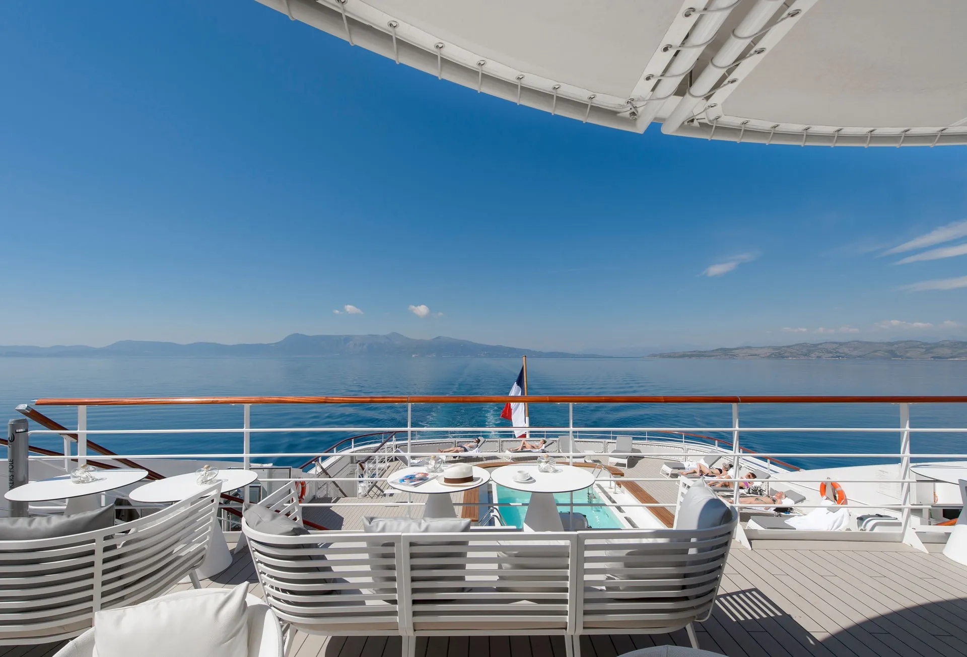 The sun deck of a Ponant yacht with a view of the sea